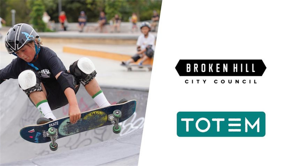 image of a boy doing a trick on a skateboard with totem and broken hill city council logos on side_ cropped